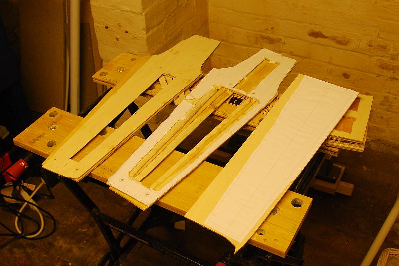 DSC_0001.JPG - laminating the ply sheets. this photo shows the cutouts in the core of the keel that will be filled with balsa.